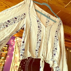 A white blouse with a bluebell floral print